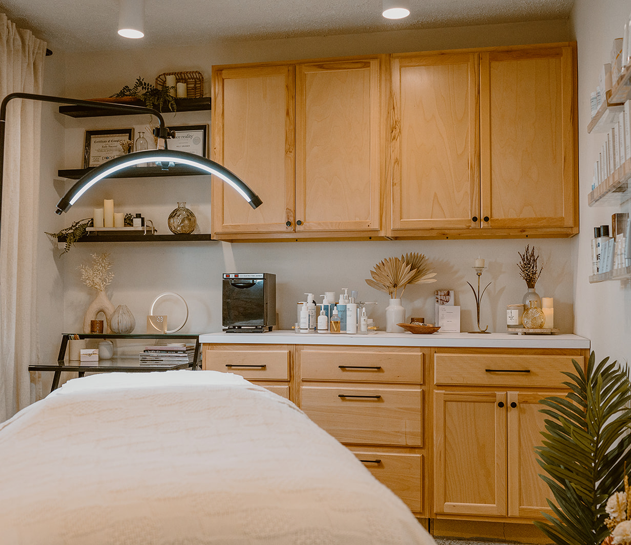 Kitchen with wooden cabinets, countertops, and decorative items.